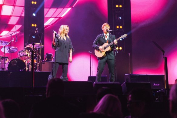 Kylie Minogue and English singer Ed Sheeran perform together at the state memorial service for Australian music legend Michael Gudinski.