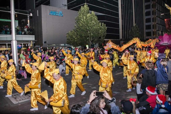 Falun Dafa performers at the 2018 Christmas Pageant. The group was allowed to perform if they agreed to remove logos from their costumes.