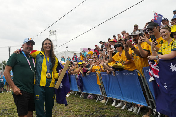 Jess Fox celebrates her gold medal with her father, Richard Fox.