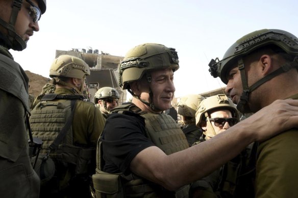 Israel Prime Minister Benjamin Netanyahu visiting soldiers at the Gaza Strip on Sunday.