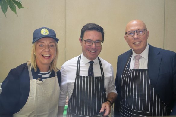 The coalition that cooks together: Bridget McKenzie (left), David Littleproud and Peter Dutton at the Nationals’ barbecue on Tuesday.