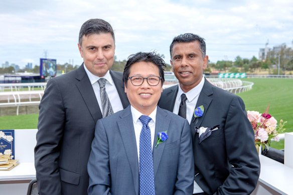 From left: Peter Crinis, Sy Giang Nguyen and Ishan Ratnam. There is no suggestion others photographed with Nguyen are involved in his alleged behaviour.
