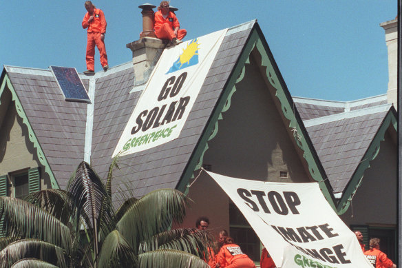 Members of Greenpeace protest the governments emissions policy by staging a sit-in on the roof of the Sydney residence of the Prime Minister Kirribilli House.