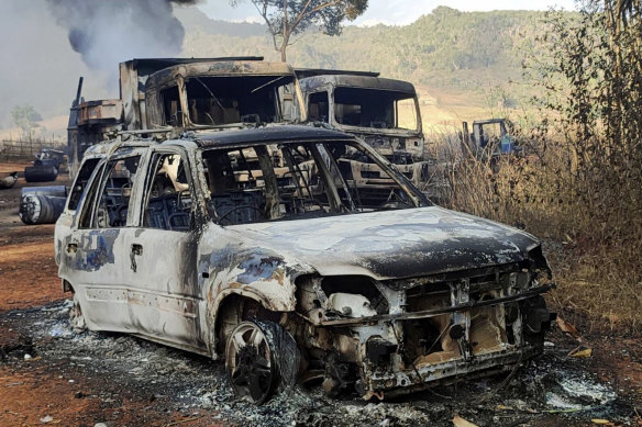 Vehicles smoulder in Hpruso township, Kayah state, Myanmar, on Friday. Villagers, some believed to be women and children, were fatally shot.