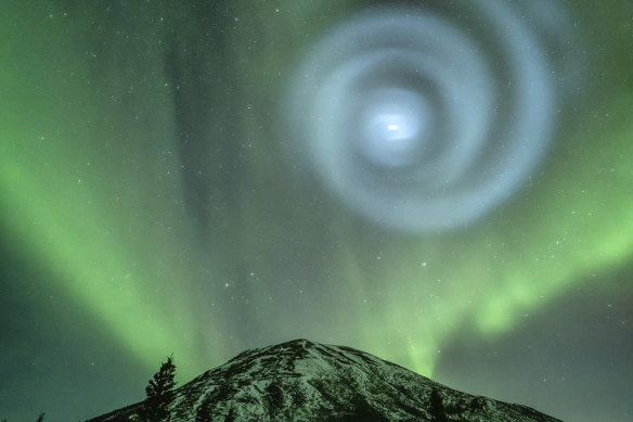 Northern light enthusiasts got a surprise when something odd was mixed in with the green bands of light dancing above the Donnelly Dome near Delta Junction, Alaska.