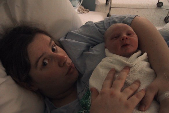 Anna Spargo-Ryan holding her first child.