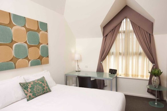 A bedroom at the Majestic Old Lion Apartments.