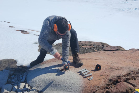 Corey Port collecting “Snicker bar” sized rock samples.