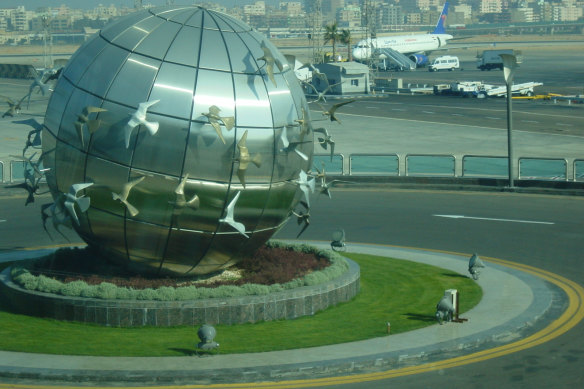 Inbound to Cairo International Airport, with a  sculpture surrounded by white doves. 