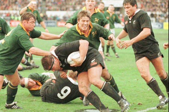 New Zealand’s Craig Dowd charges into the South Africa defence in Christchurch in 1996.