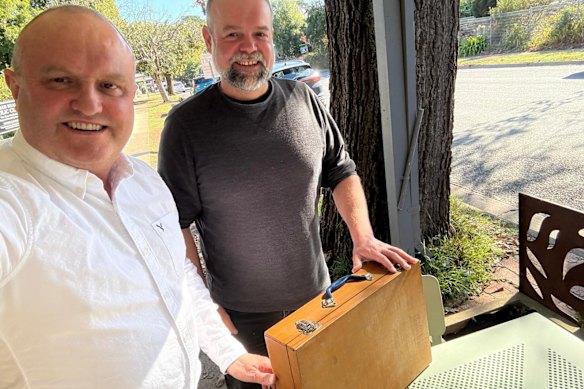 La Trobe MP Jason Wood (left), his Labor challenger, Jeff Springfield, and the long-lost wooden case.