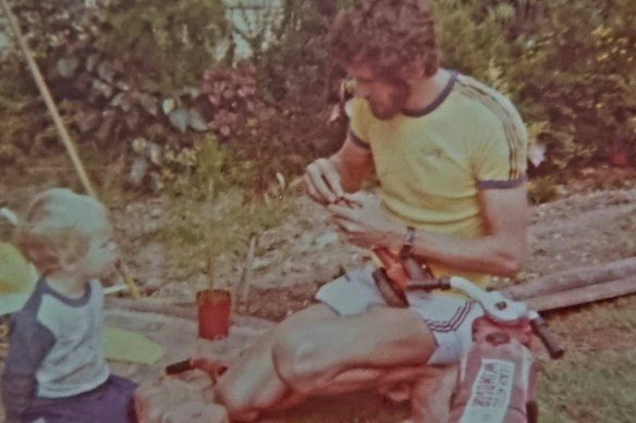 Daniel Timms in 1980 at two years old with his plumber dad, Gary, working on his elaborate garden of ponds, waterfalls and fountains.