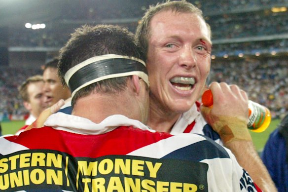 Craig Fitzgibbon hugs Sydney Roosters captain Brad Fittler after they won the 2002 title