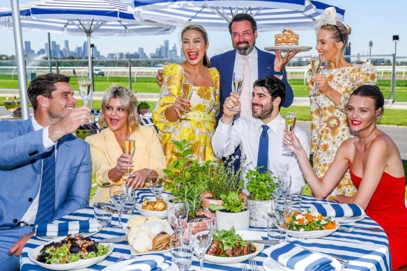 From left: Tom Hawkins, Emma Hawkins, Diana Chan, Bruce Keebaugh, Christian Petracca, Crystal Kimber and Montana Cox at Flemington on Monday.