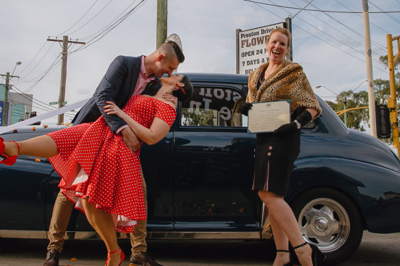 Klara McMurray (right) marries a couple, who did not want to be named, during stage three lockdown.