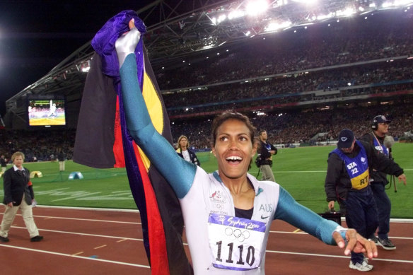 Cathy Freeman celebrates after winning gold at the Sydney Olympics.