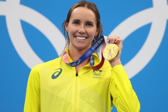 Emma McKeon with her 50m freestyle gold from Tokyo, one of a record seven medals she claimed in the Olympic pool.