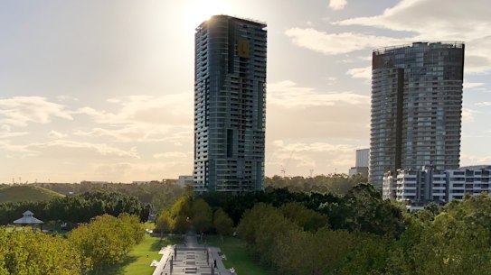 The 33-storey Opal Tower, left, was completed in August. 