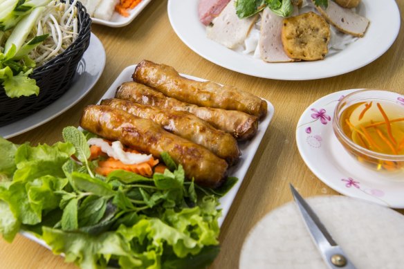 Spring rolls filled with sugar cane prawns and served with fresh herbs and nuoc cham dipping sauce.