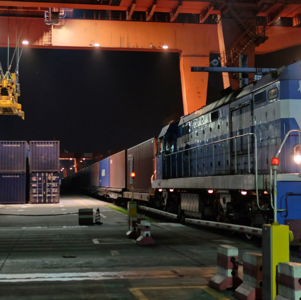 A China Railway Express train points west from Chongqing loaded with LED lights and mobile phones. China expects to run 1000 such expresses to Europe in 2018.  