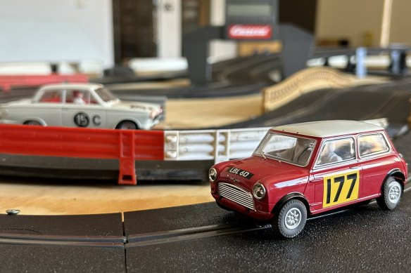 A Mini Cooper in the foreground, and in the background a Ford Cortina Mk I (a car the author once owned in real life).