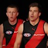 Zach Merrett leads out the Bombers in the first of their round-24 clashes.