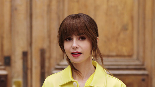 Lilly Collins as Emily Cooper, seemingly the first person in Paris ever to master social media.   