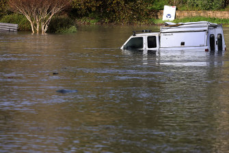 A utility vehicle is partially submerged in Santa Cruz, California, on Saturday (Sunday Australian time).