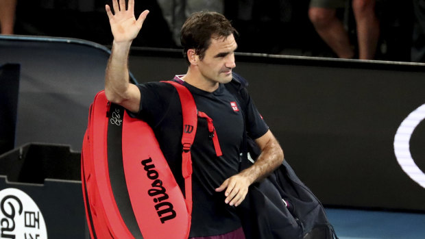 Federer waves farewell after losing in the semi-finals to Djokovic.