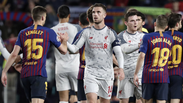 Jordan Henderson (centre) congratulates his rivals after Barcelona defeated Liverpool in the first leg of their Champions League semi-final.