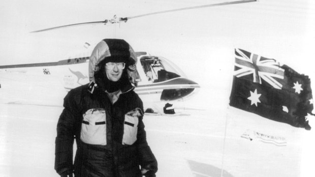 Smith on his solo flight by helicopter to the North Pole in 1990. The tattered flag was previously flown on his 1984 Everest expedition. 