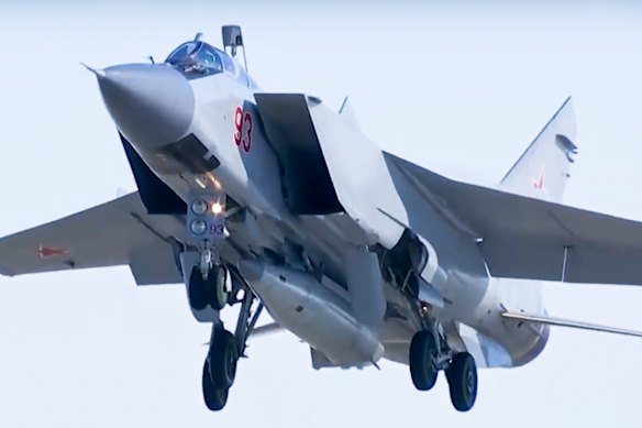 A MiG-31 fighter jet takes off carrying a Kinzhal hypersonic missile.