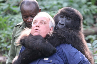 In Africa with an orphaned mountain gorilla; the species’ dwindling population was an early focus of his philanthropy.