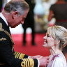 Kylie Minogue receives her OBE from the then Prince of Wales for services to music, in 2008.
