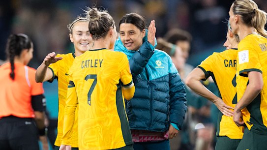 Sam Kerr celebrates with team members after their win.