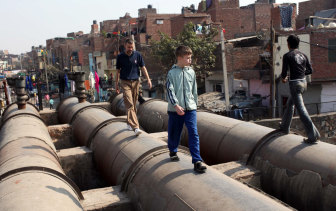 Tom Delaney with his father Mark near their Delhi home in 2009.