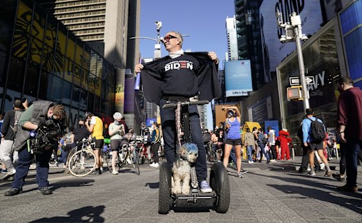People celebrate Joe Biden's victory in Times Square, New York.