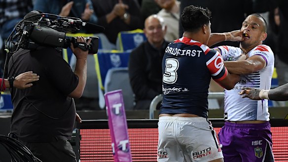 Too much to take: Latrell Mitchell and Will Chambers clash.