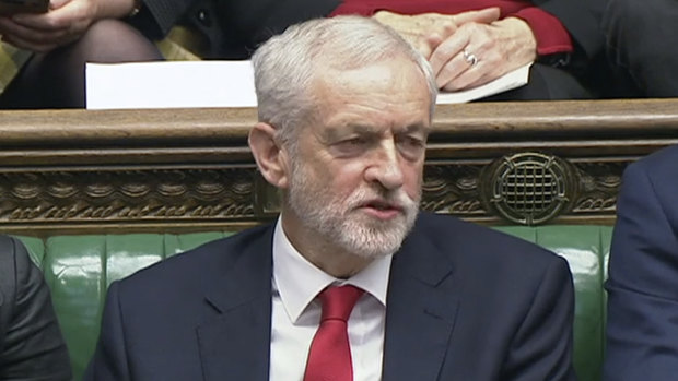 Labour leader Jeremy Corbyn says something under his breath after British Prime Minister Theresa May likened Labour's attempt to table a no-confidence motion in her to a pantomime, during the weekly Prime Minister's Questions in the House of Commons.