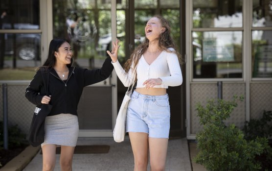 Clare Wilkes (right) and Andrhea Alabe from St Marys Senior High School leave their last HSC exam on November 11.