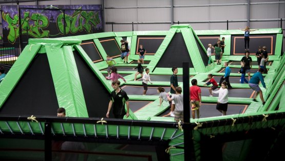 Flip Out runs indoor trampoline parks in Prestons and Canberra, pictured.