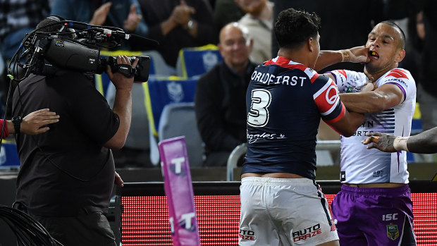 Too much to take: Latrell Mitchell and Will Chambers clash.