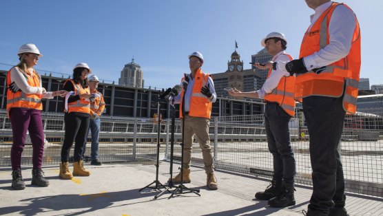 Minister for Transport Andrew Constance addresses media on the metro construction site at Central Station.