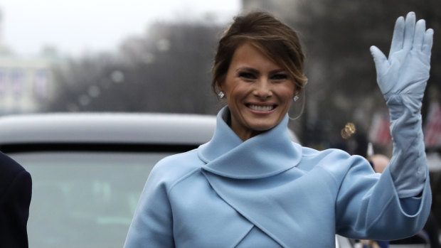 US first lady Melania Trump waves during her husband's inauguration parade on Pennsylvania Avenue, Washington, in 2016.