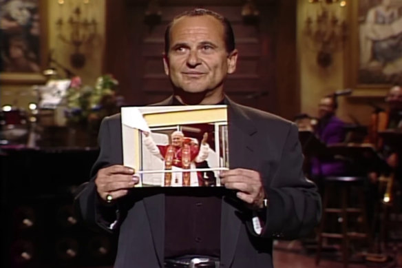 Joe Pesci holds up the taped-together photo of Pope John Paul II that O’Connor had ripped.