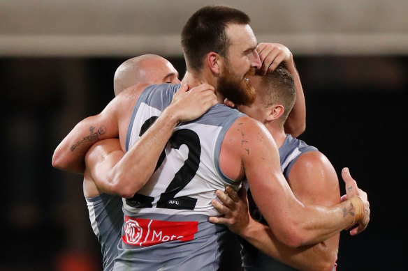 Port secured the minor premiership by beating Collingwood on Monday night.