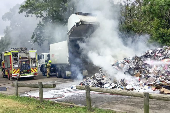 NSW fire brigade extinguishing the remains of a fire caused by disposable batteries.