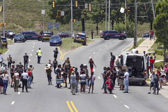 Protesters block a road near the Wendy's fast food restaurant in Atlanta on Saturday where Rayshard Brooks was killed. 