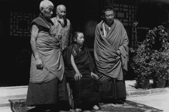 Rules of Tibet: The Panchen Lama, a boy of 11, is the spiritual leader of the Tibetan hierarchy. Behind him stands the 73-year-old Regent while on either side are the spiritual instructors. The present Panchen Lama is the 10th reincarnation. He lives with the Regent, Lo-ch'ang-chan, at the lamasery of Kumbum. April 22, 1950.