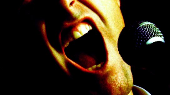 I’m witnessing a crime. “He’s murdering John Farnham’s You’re The Voice.”